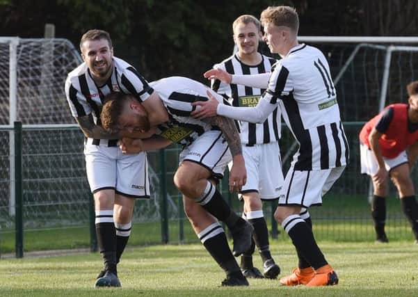 Josh Rosser (middle) of Peterborough Northern Star celebrates scoring against Harborough Town. Picture: Chantelle McDonald