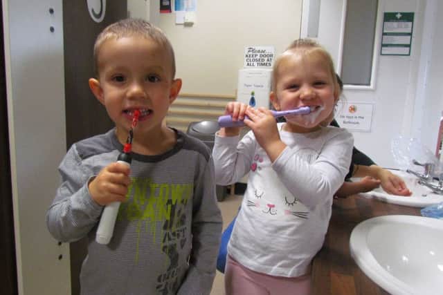 Nursery children visit local dentist and practice teeth brushing to promote oral health