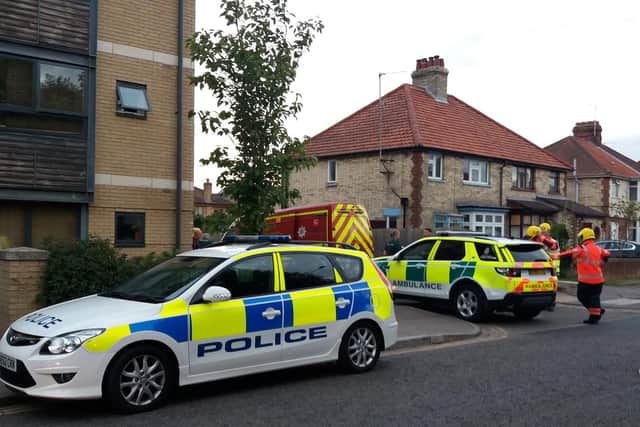 Police and emergency services at the scene where Heidi Chalkley died after getting trapped in a faulty garage door