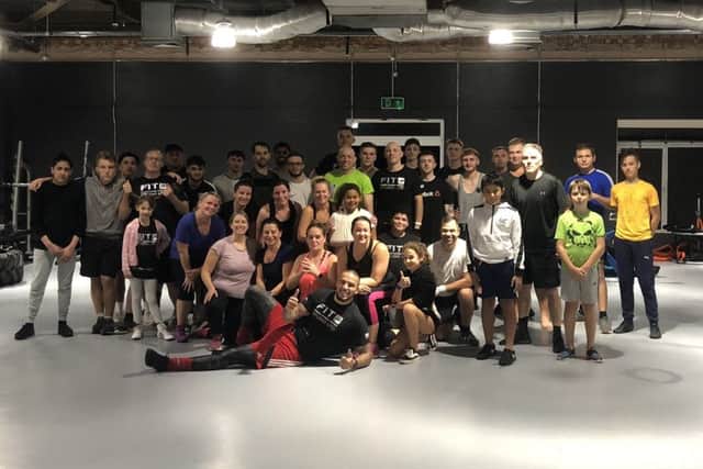 Karl Wheeler (front) with members of his new gym F.I.T. Studio.