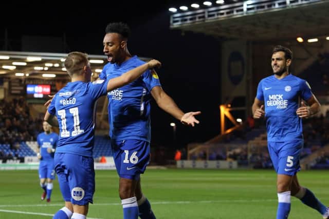 Rhys Bennett celebrates his winning Posh goal with Louis Reed. Photo: Joe Dent/theposh.com.