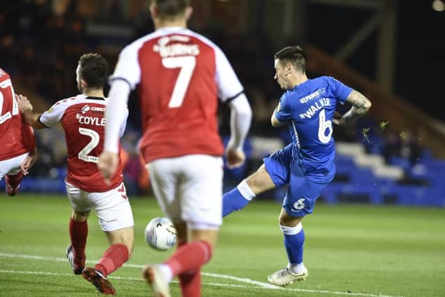 Posh attacking midfielder Jamie Walker shoots at the Fleetwood goal. Photo: David Lowndes.