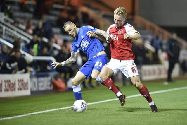 Marcus Maddison of Posh battles for possession against Fleetwood. Photo: David Lowndes.