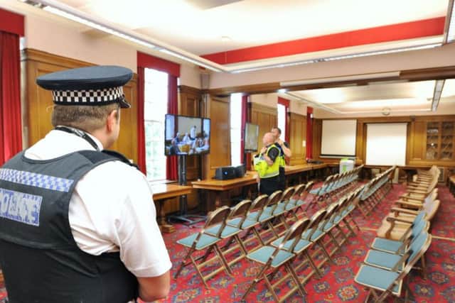 Police have been attending Peterborough City Council meetings after protests from the public gallery against Andy Coles.