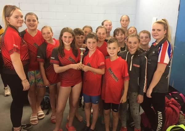 The Deepings Swimming Club team with their third-place trophy in the Junior Fenland League B Final