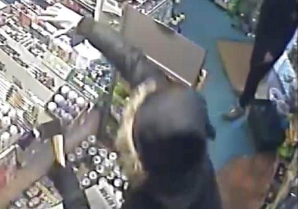 One of the men armed with an axe