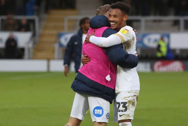 Tyler Denton of Peterborough United celebrates the victory at full-time at Burton (photo: Joe Dent/theposh.com).