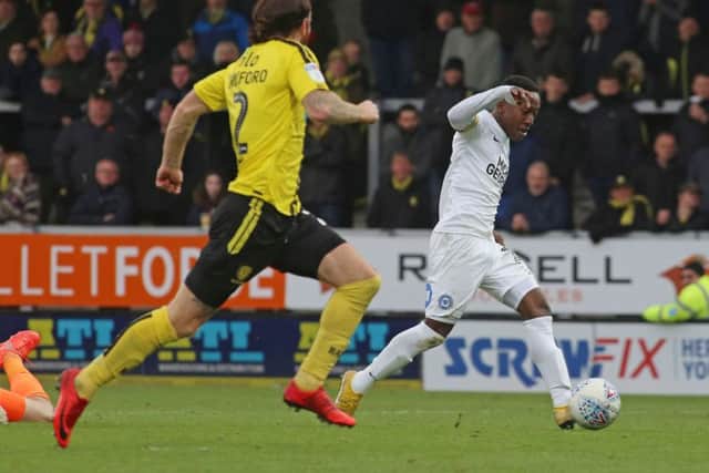 Siriki Dembele of Peterborough United scores his sides second goal of the game at Burton. Photo: Joe Dent/theposh.com.