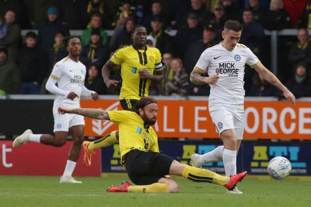 Posh substitute Jamie Walker takes the ball past Burton's John Brayford. Photo: Joe Dent/theposh.com.