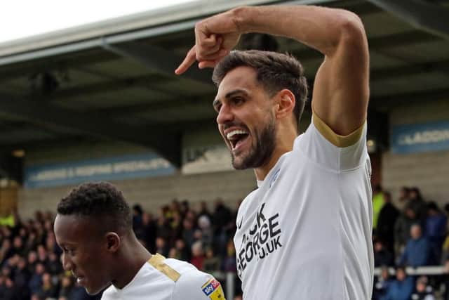 Posh centre-back Ryan Tafazolli salutes wing wizard Siriki Dembele. Photo: Joe Dent/theposh.com