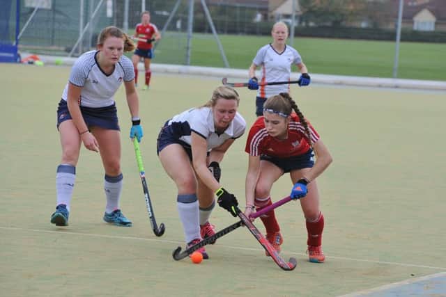 City of Peterborough Ladies in action (red).