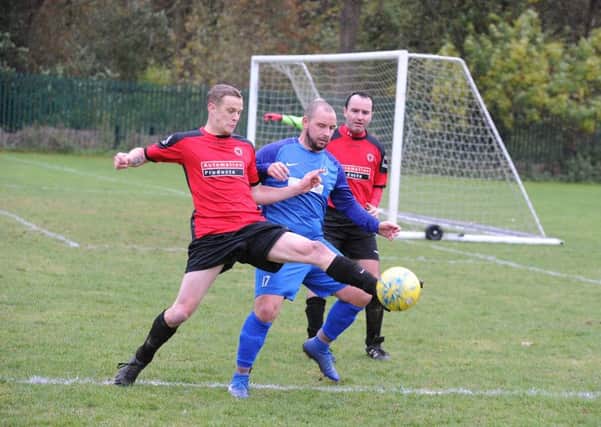 Action from Feeder (blue) 0, Netherton United Reserves 8 in Division Two of the Peterborough League. Photo: David Lowndes.