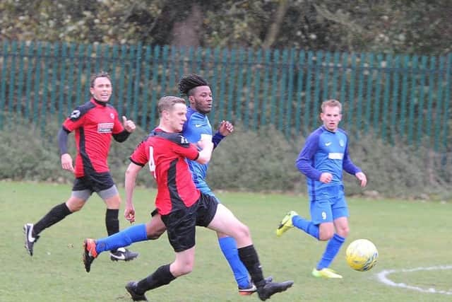 Action from Feeder (blue) 0, Netherton United Reserves 8 in Division Two of the Peterborough League. Photo: David Lowndes.