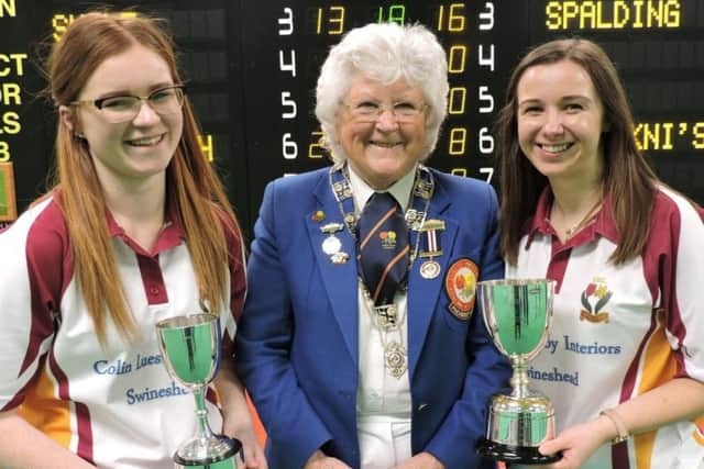 Ruby Hill (left) and Chelsea Tomlin with EIBA president Margaret Allen after winning the national womens indoor pairs title in March.