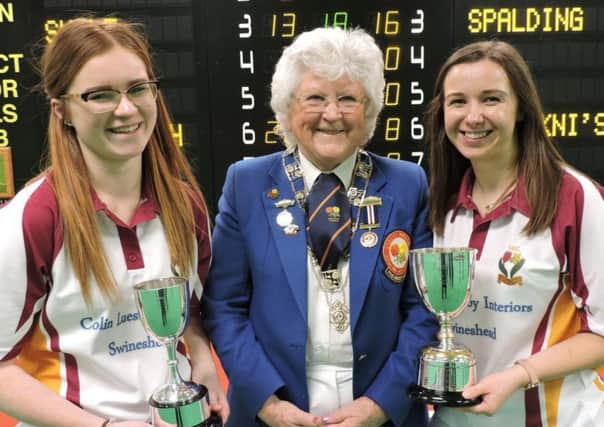 Ruby Hill (left) and Chelsea Tomlin with EIBA president Margaret Allen after winning the national womens indoor pairs title in March.