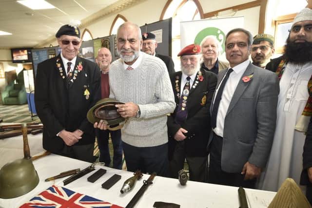 Shared History Let's Not Forget open day and Remembrance at Ghousia Mosque, Peterborough. Guests with mosque members including Ansar Ali EMN-180311-232959009