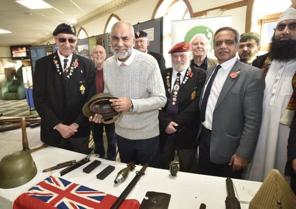 Shared History Let's Not Forget open day and Remembrance at Ghousia Mosque, Peterborough. Guests with mosque members including Ansar Ali EMN-180311-232959009
