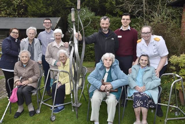 Sculptor Kurt Lightfoot from Orna-Metal UK with his bird feeder installed in the garden at Florence House care home, Park Road. He is joined in the garden by residents and staff at the House EMN-181031-082907009