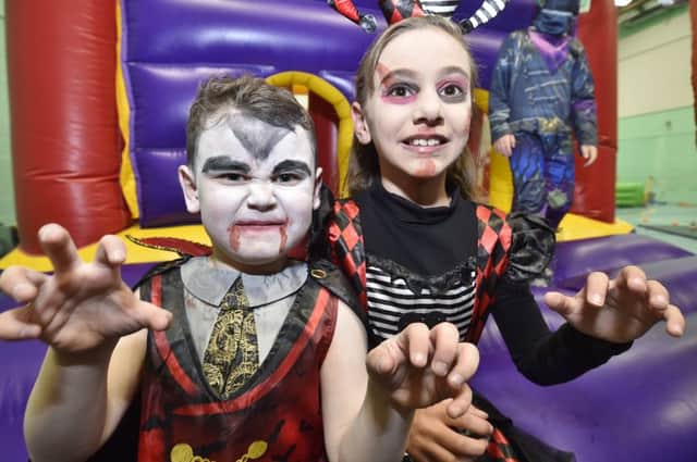 Charity halloween party at Hampton Leisure  Centre  in aid of Alzheimer's UK pictured with local children  Rosaria Christiano and Riley Covell (R to  L) EMN-181028-122302009