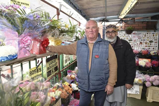 Steve Lovelace and Khahil Ahmed from the flower stall at Peterborough Market EMN-181031-120103009