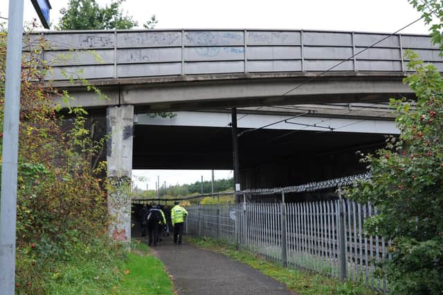 Police officers putting out notices and talking to passers-by on a walkway between Rhubarb Bridge at North Bretton - the scene of one of the attacks