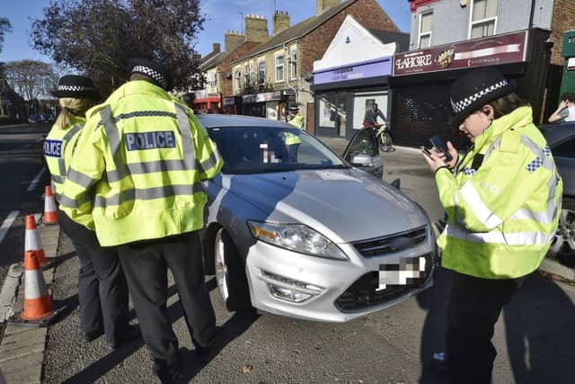 A car being seized in Millfield