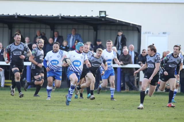 The LIons on the run against Otley. Picture: Mick Sutterby