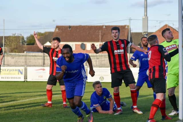 Avelino Vieira wheels away in delight after scoring for Peterborough Sports against Thame. Photo: James Richardson.