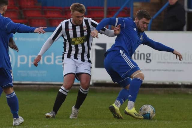Jake Sansby (stripes) of Peterborough Northern Star in action against Redbridge. Photo: Chantelle McDonald. @cmcdphotos.