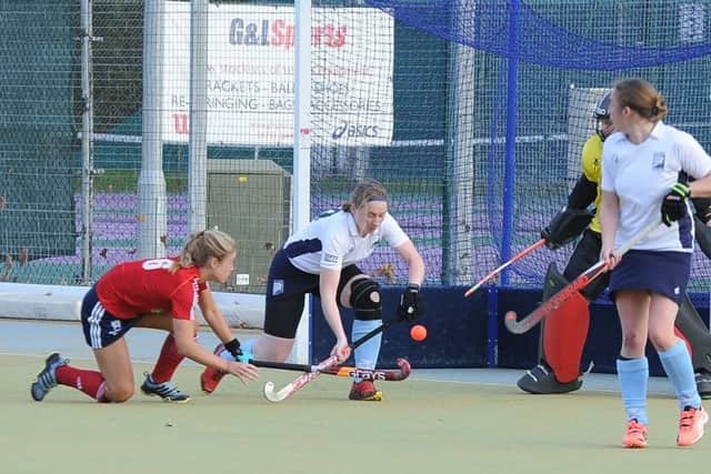 City of Peterborough Ladies (red) onb the attack against West Herts.  Photo: David Lowndes.