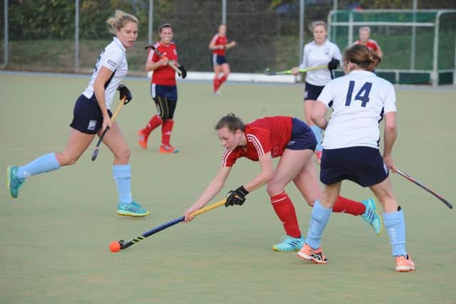 Action from City of Peterborough Ladies (red) 4-3 win over West Herts.  Photo: David Lowndes.