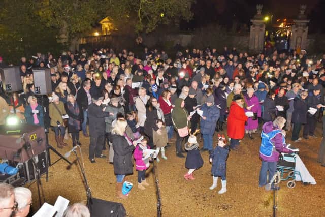Lights of Love service 2016 at Sue Ryder Thorpe Hall .Visitors singing carols EMN-161112-194218009