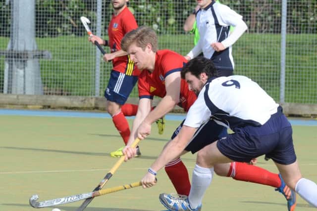 Danny Sisson (red) hit the post for City of Peterborough at Oxted.