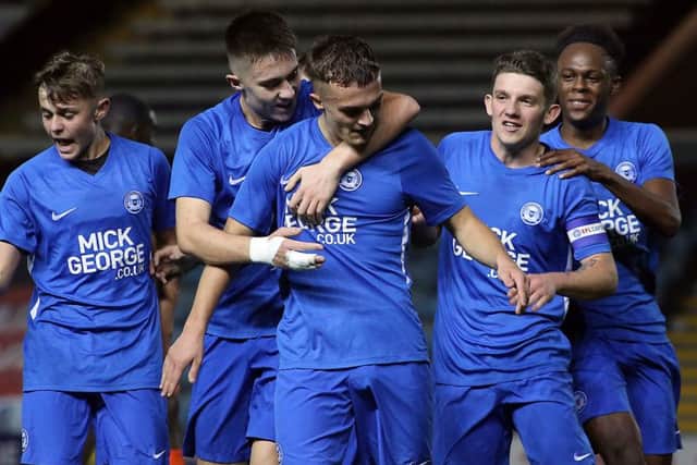Posh Youths celebrate a goal against Luton.
