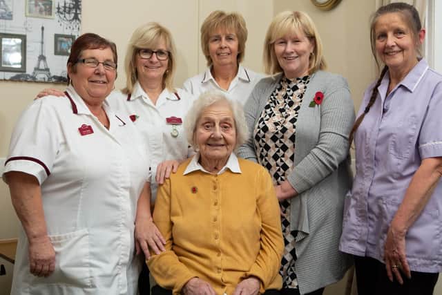 Connie with staff at the care home. Photo: Terry Harris