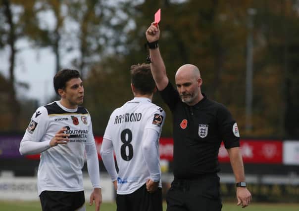 Frankie Raymond (8) of Bromley is sent off by referee Kevin Johnson in the FA Cup tie against Posh. Photo: Joe Dent/theposh.com.