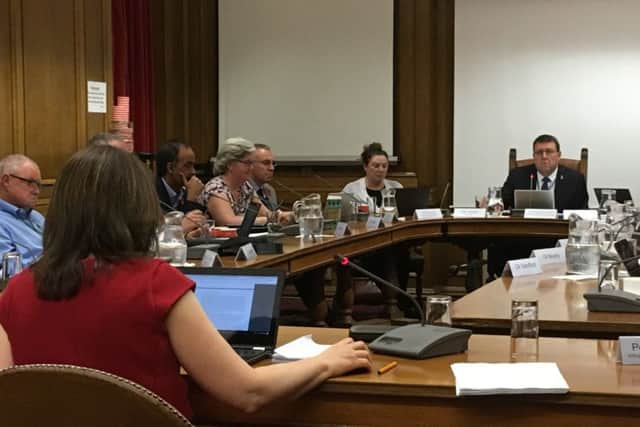 The committee discussing the report