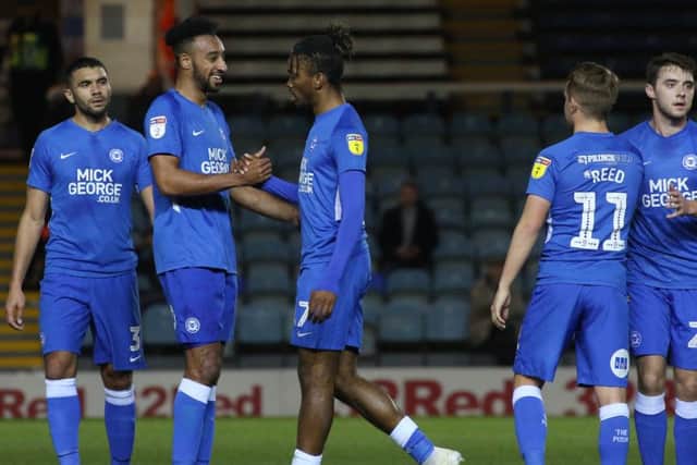 Posh skipper Rhys Bennett (left) congratulates Ivan Toney on his goal against Luton. Photo: Joe Dent/theposh.com.