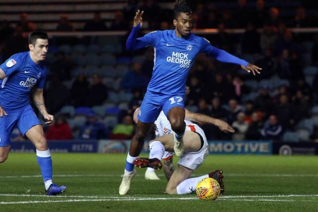 Ivan Toney of Peterborough United skips past a Luton Town defender. Photo: Joe Dent/theposh.com.