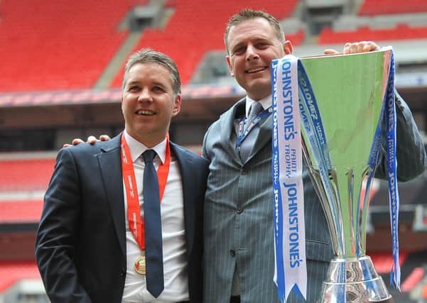 Posh manager Steve Evans wants to take chairman Darragh MacAnthony (pictured here with former manager Darren Ferguson and the Johnstone's Paint Trophy) back to Wembley.