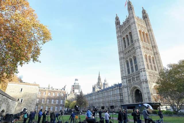 Media gather outside the House of Commons ahead of Prime Minister Theresa May's Brexit deal statement to MPs.