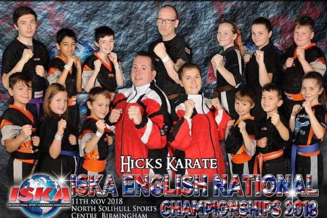 The Hicks Karate School team that competed at the ISKA Nationals. From the left are, back row, Aaron Dickerson, Shiv Panchal, Aaron Leonard, David Prior, Annie Dickerson, Casey Stone, Warren Bothamley, front, Denas Jankauskas, Sophie Hicks, Oliver Profitt, Andrew Hicks, Atlanta Hickman, Joshua Leonard, Tajus Jankauskas and Sophie Doyle.