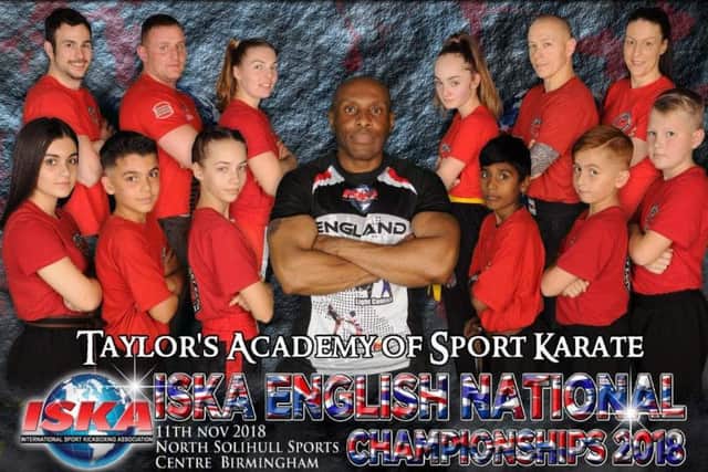 The Taylors Academy team that competed at the ISKA Nationals.  The team, pictured with chief instructor Rob Taylor (centre) , was from  the left, back, Richard Atkinson, Ernestas Girdauskas, Lucy Stirland, Eva Andrulyte, Saulius Serzantux,  Helen Sutcliffe, front, Jazmyn Evans, Braydon Evans, Fortunata Jurkstaite, Raihan Ebrahim, Taylor Popat-Evans  and Joris Balocka.