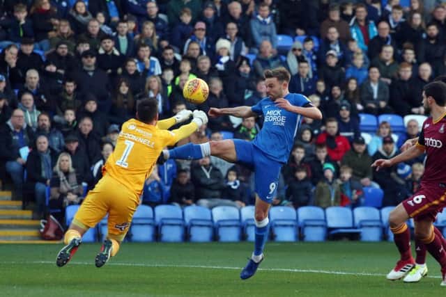 Posh striker Matt Godden is beaten to the ball by Bradford City goalkeeper Richard O'Donnell. Photo: Joe Dent/theposh.com.