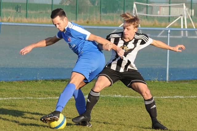 Action from Whittlesey Athletic's 3-3 draw with Long Sutton Athletic (stripes) in the Peterborough Premier Division. Photo: David Lowndes.