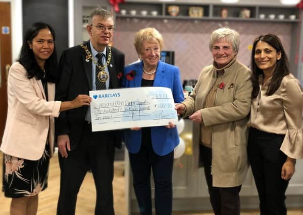 The cheque presentation Pictured L-R, Christina Hartles, Councillor Chris Ash, Audrey Scotney, Mala Agawol, Managing Director
