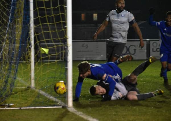 Peterborough Sports' striker Mark Jones bundles the ball over the line against Bedford. Photo: James Richardson.