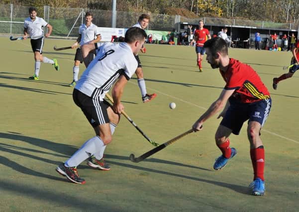 Action from City of Peterborough (red) v Southgate. Photo: David Lowndes.