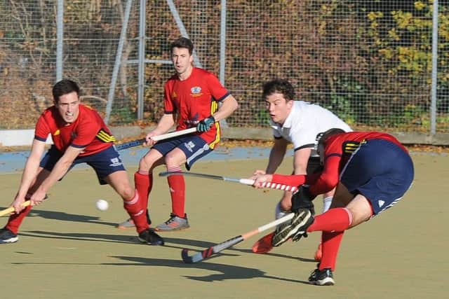 Action from City of Peterborough (red) v Southgate. Photo: David Lowndes.