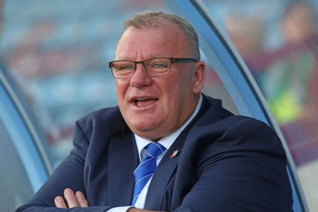 Posh manaber Steve Evans is confident he can handle the club's expectations.
